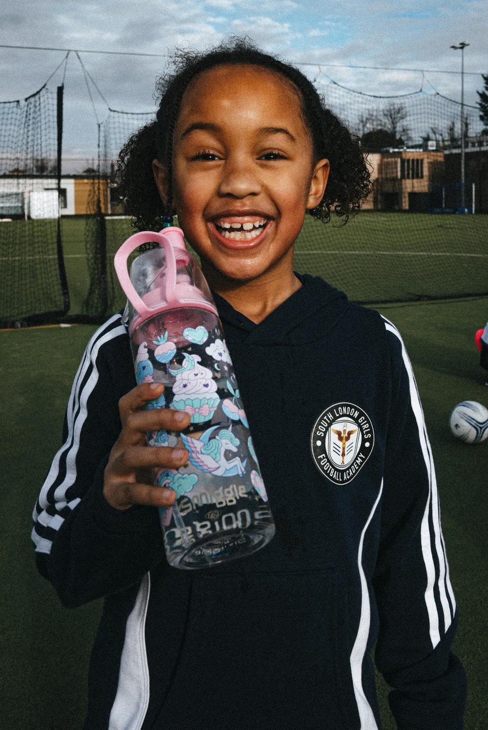 A smiling young player at a SLGFL Sunday session